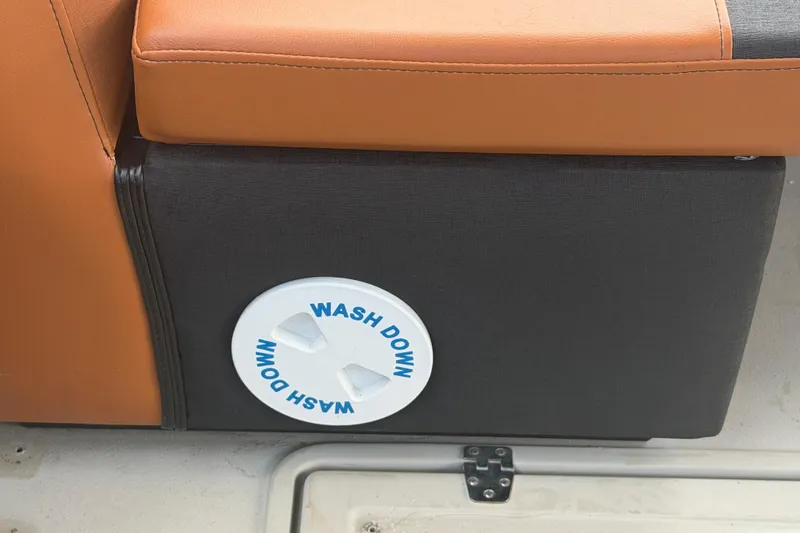 Slide: The Image of Wash down valve on 2015 Premier 290 Grand View boat with orange seating. - 87