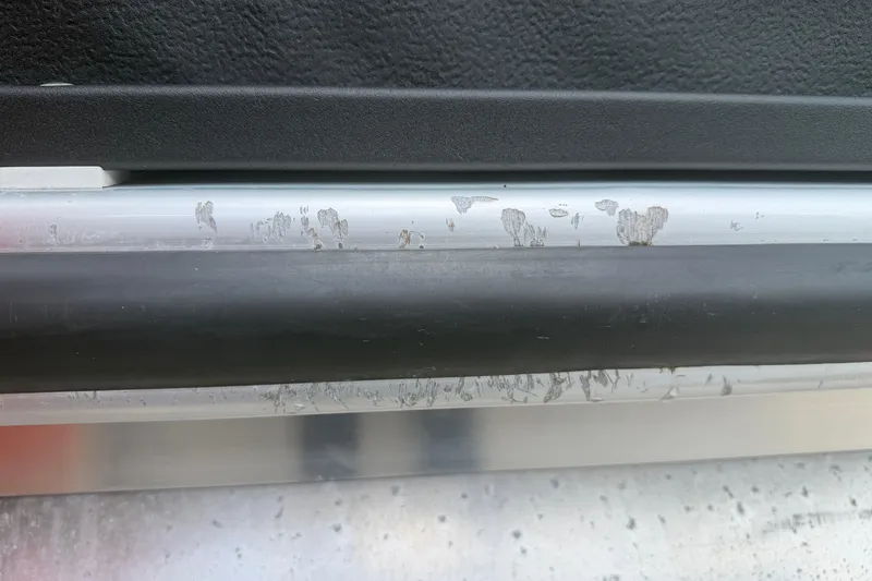 Slide: The Image of Close-up of a 2015 Premier 290 Grand View with visible wear on metal surface. - 16