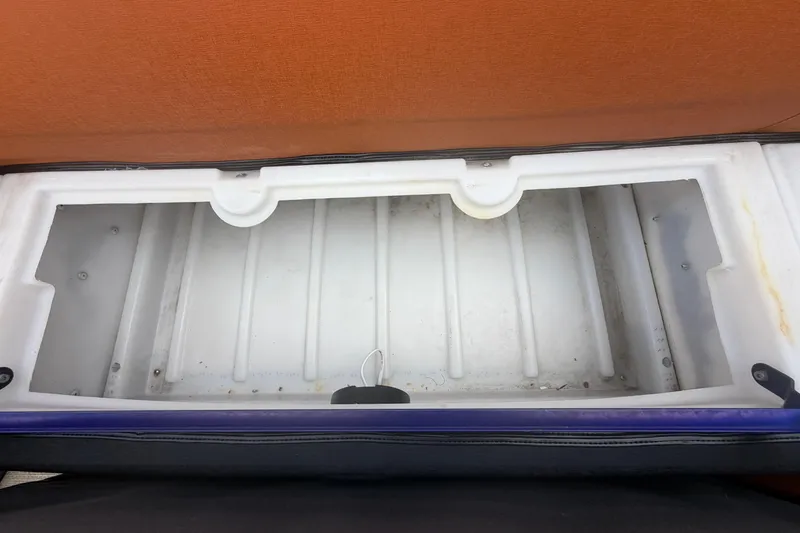 Slide: The Image of Open storage compartment in a 2015 Premier 290 Grand View boat. - 50