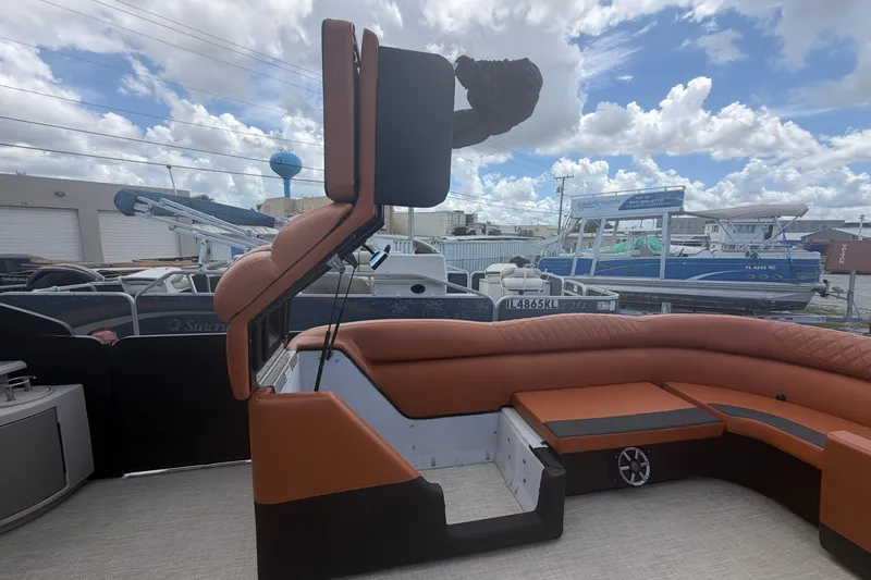 Slide: The Image of 2015 Premier 290 Grand View boat interior with brown seating and adjustable backrest. - 46