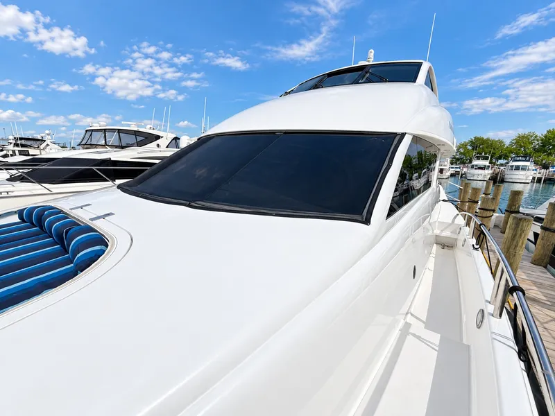 Slide: The Image of The 2002 Lazzara 80 Skylounge is docked. It features a sleek, modern design. - 31