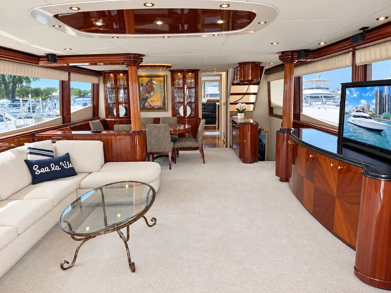 Slide: The Image of Luxurious salon with elegant wood accents, comfortable sofas, and a large flat-screen TV. - 33