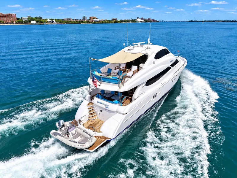 Slide: The Image of A luxurious white yacht cruising on blue water, featuring a spacious deck and sunshade. - 20