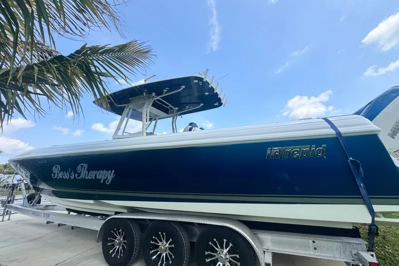 Slide: The Image of 2007 Intrepid 370 Center Console boat on trailer under blue sky. - 22