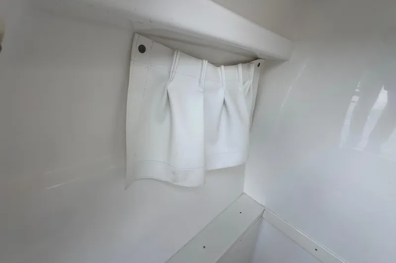 Slide: The Image of White storage pocket inside 2007 Intrepid 370 Center Console boat. - 91