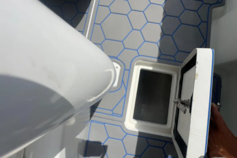 Slide: The Image of Open hatch on 2007 Intrepid 370 Center Console boat with hexagonal floor pattern. - 61