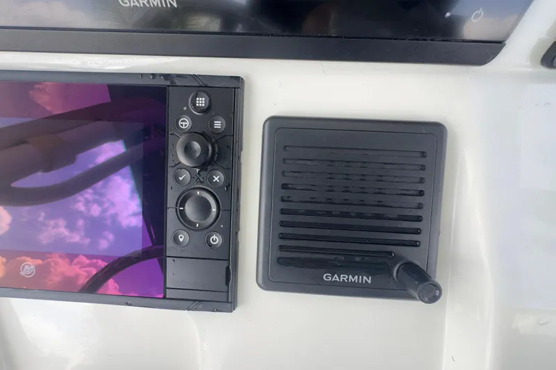 Slide: The Image of Garmin marine electronics on 2007 Intrepid 370 Center Console boat dashboard. - 81