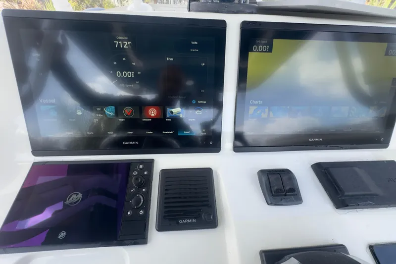 Slide: The Image of Dashboard of a 2007 Intrepid 370 Center Console with Garmin displays. - 72