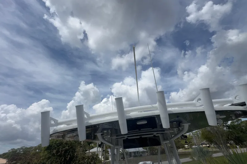 Slide: The Image of 2007 Intrepid 370 Center Console boat against a cloudy sky backdrop. - 85