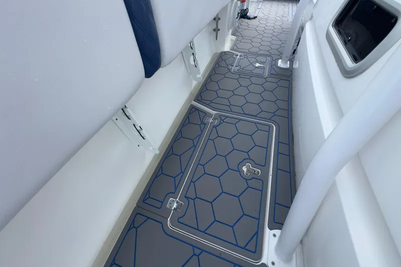 Slide: The Image of 2007 Intrepid 370 Center Console boat deck with hexagonal pattern flooring. - 67