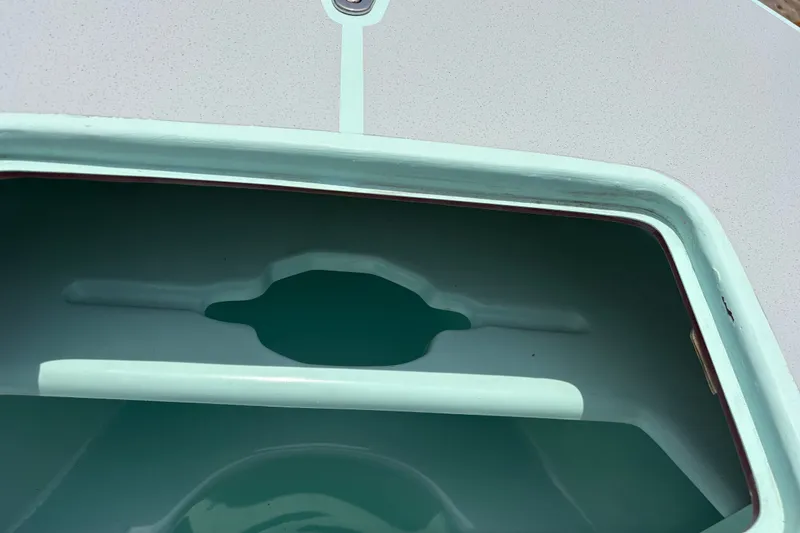 Slide: The Image of 2024 Exuma 22 boat hatch detail with light blue interior and sleek design. - 33