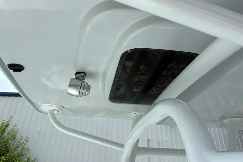 Slide: The Image of 2024 Exuma 22 boat detail showing underside structure and mounted light. - 24