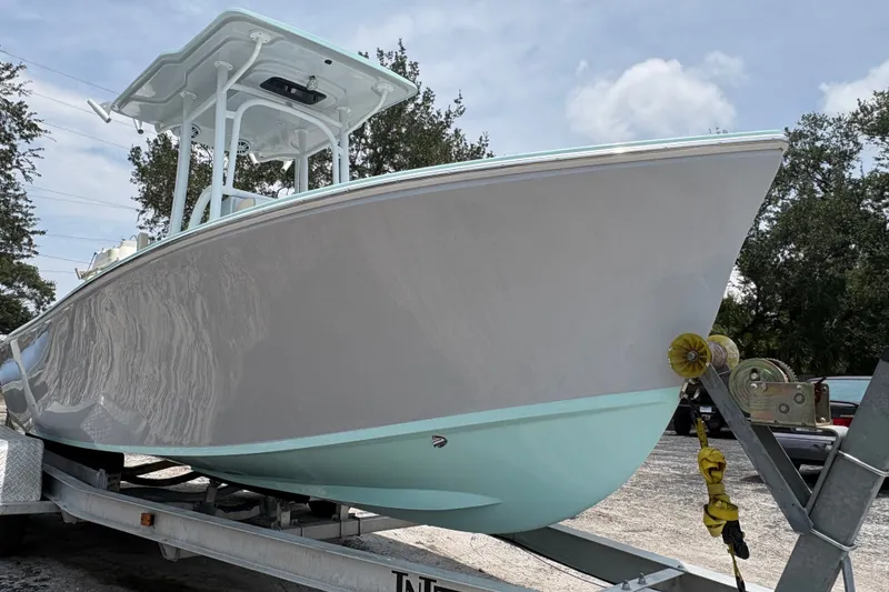 Slide: The Image of 2024 Exuma 22 boat on trailer, showcasing sleek design and modern features. - 10