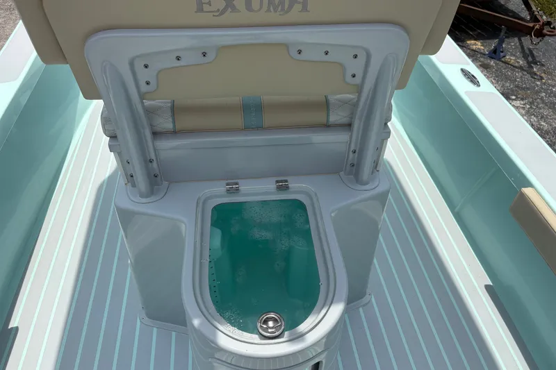 Slide: The Image of 2024 Exuma 22 boat interior with livewell and cushioned seating. - 13