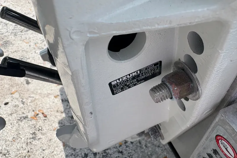Slide: The Image of Close-up of a Suzuki outboard motor part on a 2024 Exuma 22 boat. - 29