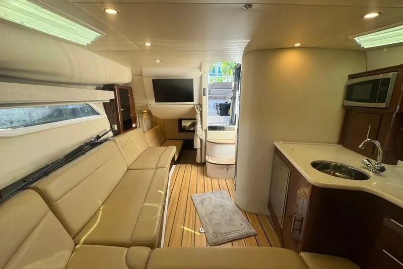 Slide: The Image of Luxurious interior of a 2015 Regal 35 Sport Coupe yacht with modern amenities. - 48