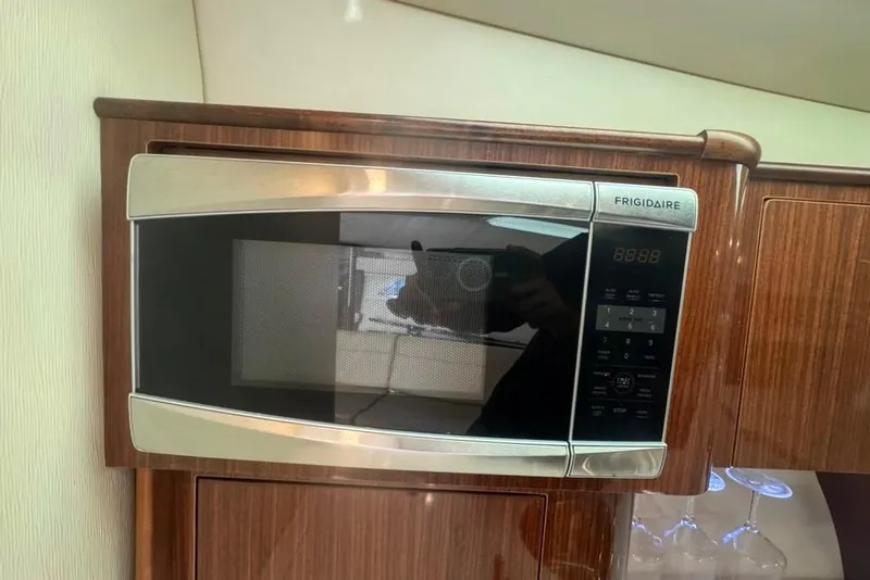 Slide: The Image of Frigidaire microwave in 2015 Regal 35 Sport Coupe yacht kitchen. - 51