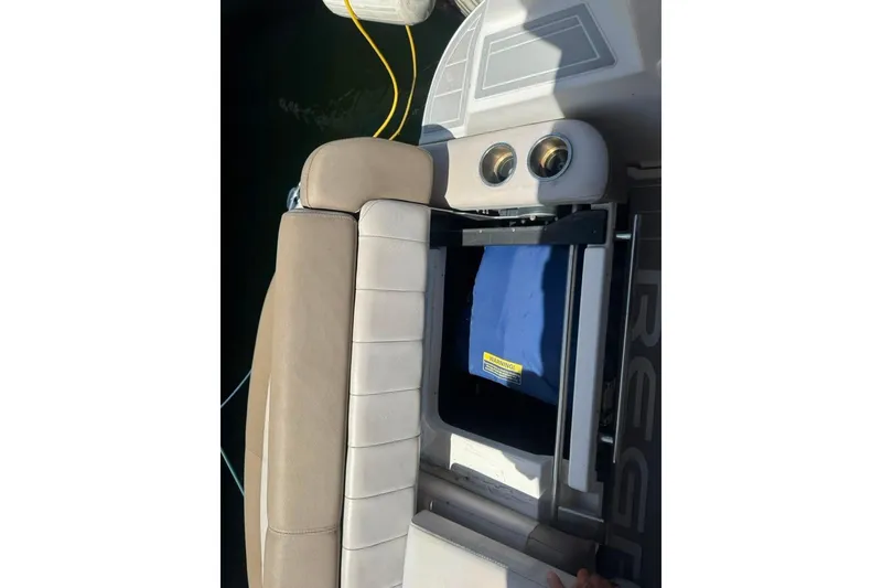 Slide: The Image of 2015 Regal 35 Sport Coupe boat seat with storage compartment open. - 29