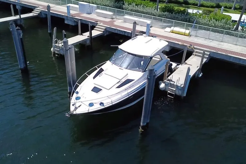 Slide: The Image of 2015 Regal 35 Sport Coupe docked at a marina, viewed from above. - 16