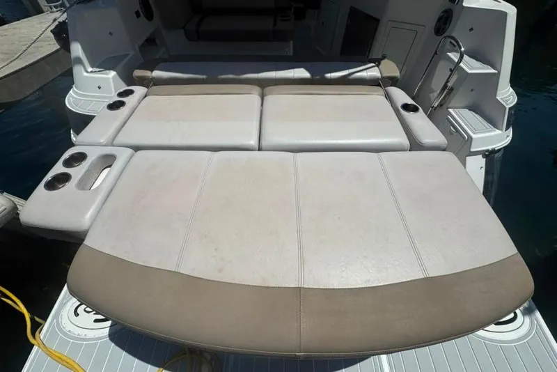 Slide: The Image of 2015 Regal 35 Sport Coupe boat with spacious sunbed and cup holders on deck. - 21