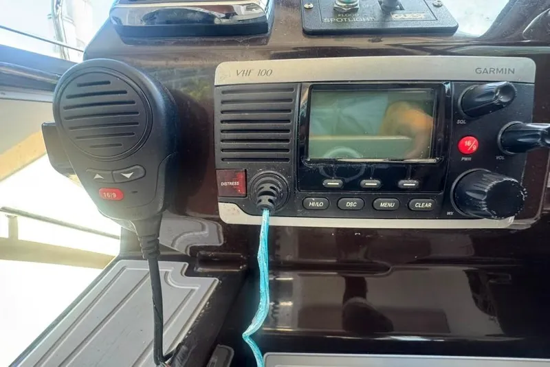 Slide: The Image of VHF radio system on 2015 Regal 35 Sport Coupe boat dashboard. - 88