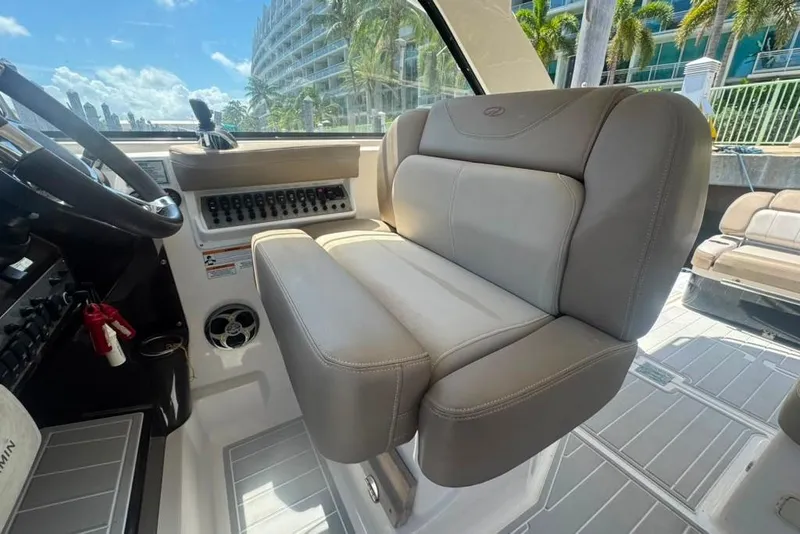 Slide: The Image of Interior of 2015 Regal 35 Sport Coupe with plush seating and control panel. - 31