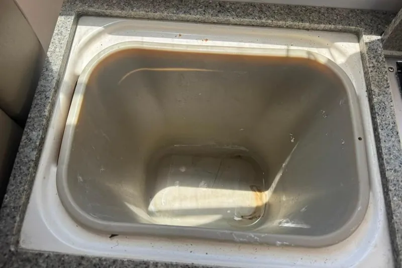 Slide: The Image of Dirty sink in a 2015 Regal 35 Sport Coupe boat kitchen. - 91