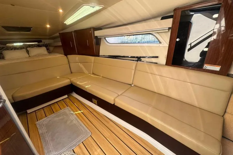 Slide: The Image of Luxurious interior of 2015 Regal 35 Sport Coupe with beige seating and wooden accents. - 45