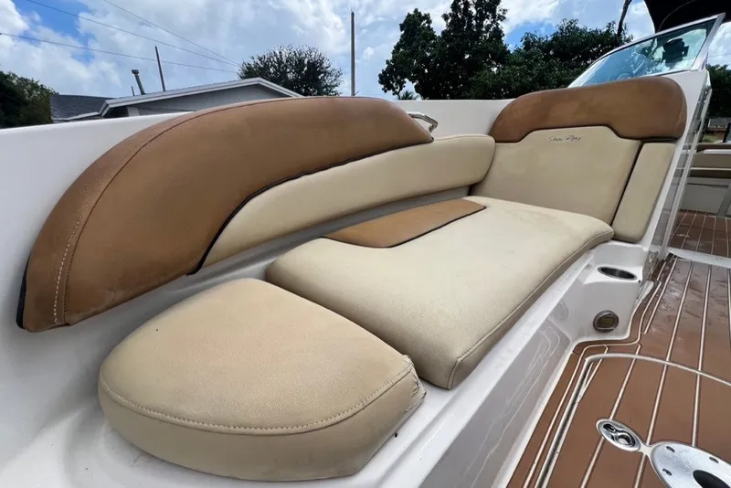 Slide: The Image of 2007 Sea Ray 260 Sundeck boat seating with tan and cream upholstery. - 47