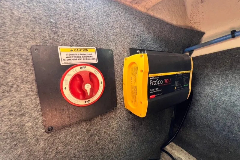 Slide: The Image of Battery switch and charger in 2007 Sea Ray 260 Sundeck boat. - 31