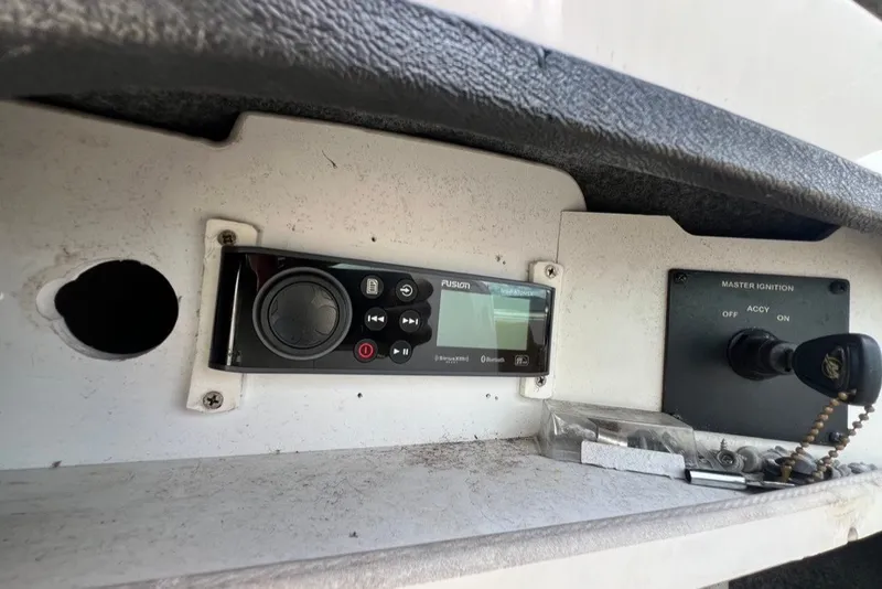 Slide: The Image of Control panel of a 2007 Sea Ray 260 Sundeck boat with ignition and audio system. - 38