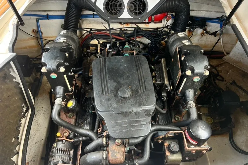 Slide: The Image of Engine compartment of a 2007 Sea Ray 260 Sundeck boat, showing detailed components. - 58