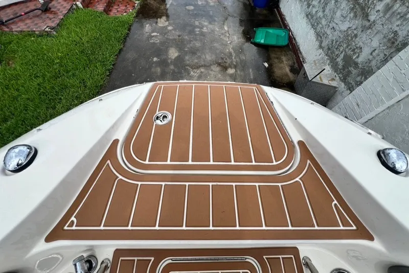 Slide: The Image of 2007 Sea Ray 260 Sundeck boat deck with brown and white non-slip surface. - 49