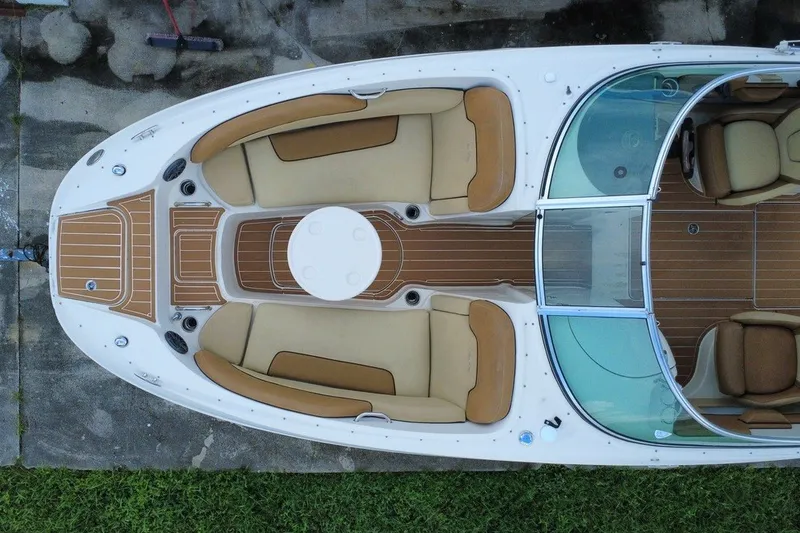 Slide: The Image of Overhead view of a 2007 Sea Ray 260 Sundeck boat with tan seating and wood accents. - 6