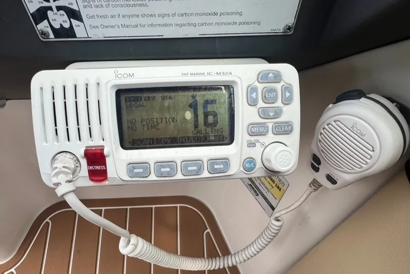 Slide: The Image of VHF marine radio on 2007 Sea Ray 260 Sundeck, displaying channel 16. - 84
