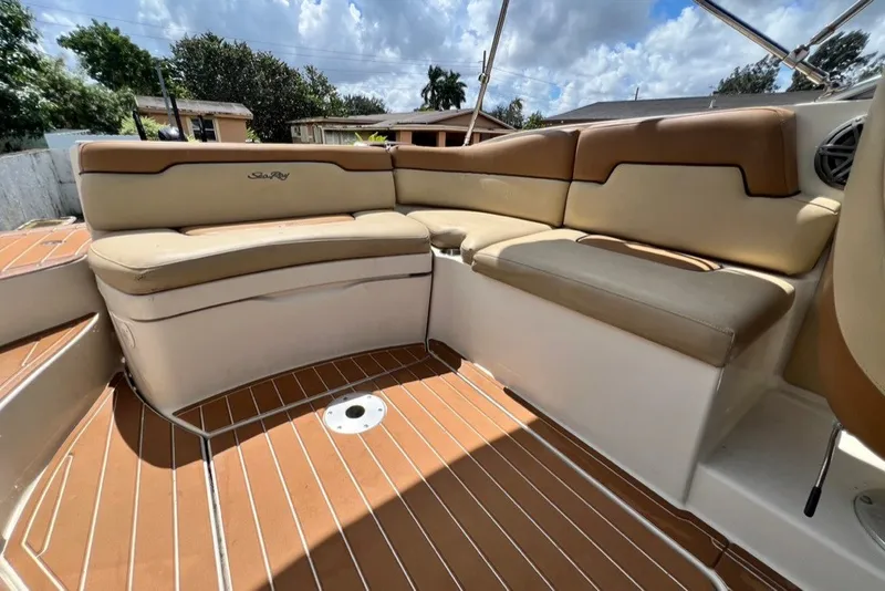 Slide: The Image of 2007 Sea Ray 260 Sundeck interior with tan seating and teak-style flooring. - 19