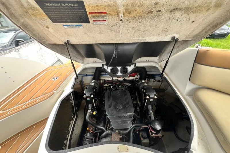 Slide: The Image of Engine compartment of a 2007 Sea Ray 260 Sundeck boat with open hatch. - 59
