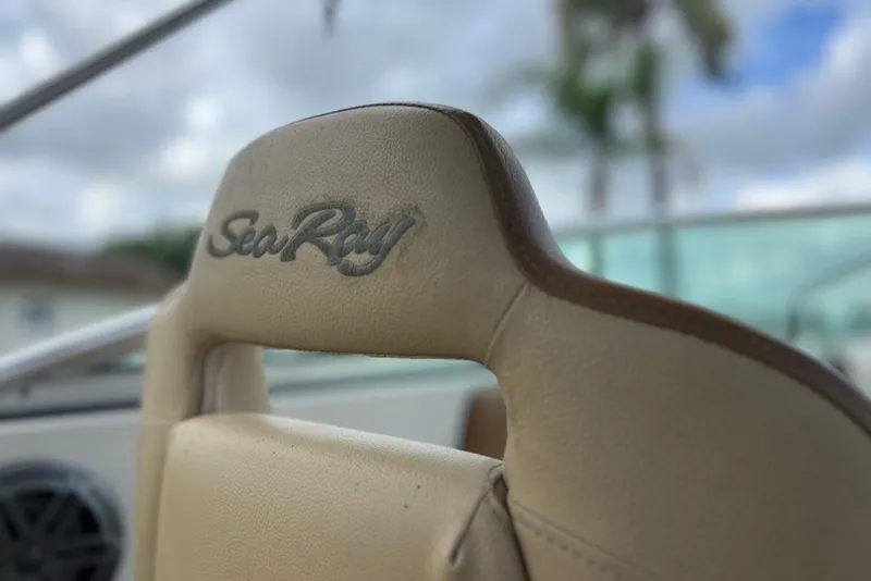 Slide: The Image of Close-up of 2007 Sea Ray 260 Sundeck boat seat with logo. - 65