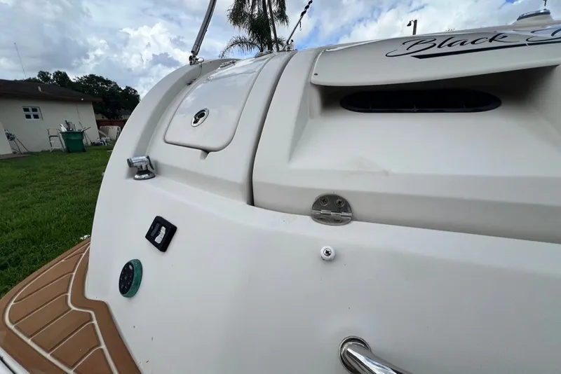 Slide: The Image of 2007 Sea Ray 260 Sundeck boat stern, featuring storage compartments and sleek design. - 79