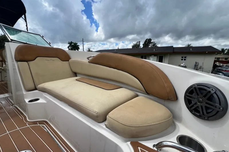 Slide: The Image of 2007 Sea Ray 260 Sundeck boat interior with cushioned seating and speaker. - 46