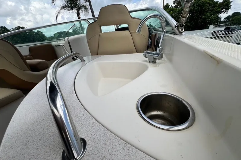 Slide: The Image of 2007 Sea Ray 260 Sundeck boat interior with sink and seating area. - 69