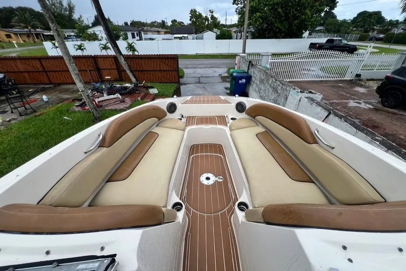 Slide: The Image of 2007 Sea Ray 260 Sundeck boat with spacious seating and teak-style flooring. - 55