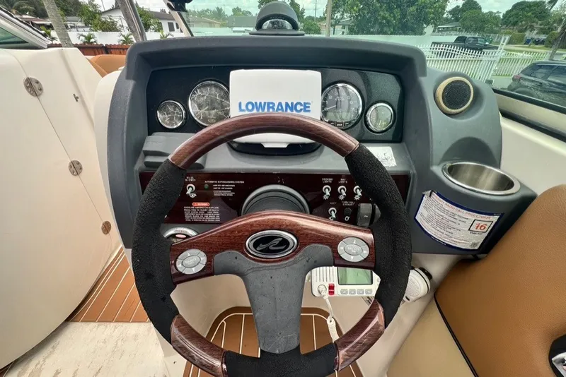 Slide: The Image of Steering wheel and dashboard of a 2007 Sea Ray 260 Sundeck boat. - 82