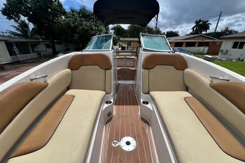 Slide: The Image of 2007 Sea Ray 260 Sundeck interior with tan seating and wooden flooring. - 45