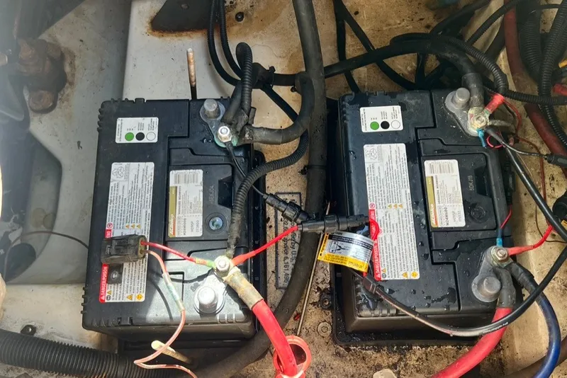 Slide: The Image of Batteries in a 2007 Sea Ray 260 Sundeck boat engine compartment. - 25