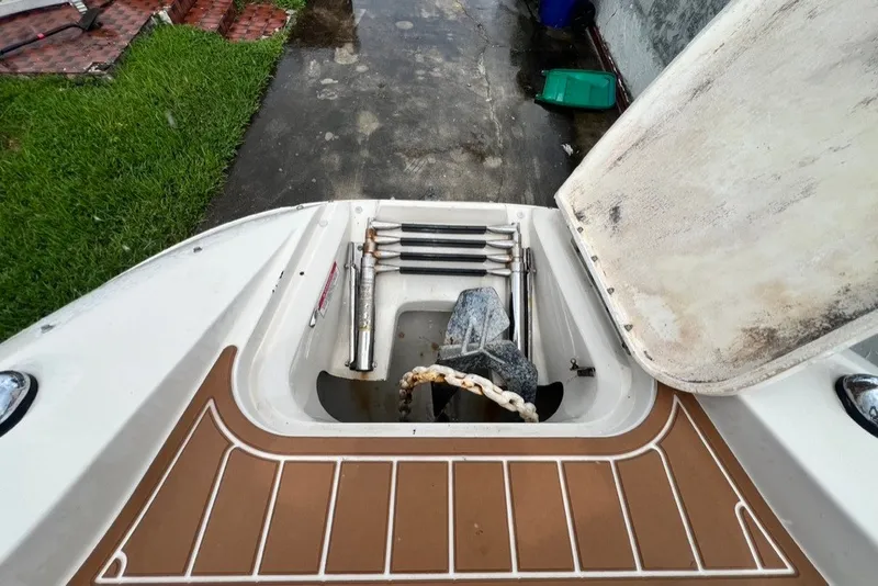 Slide: The Image of Open anchor compartment on 2007 Sea Ray 260 Sundeck boat, showing anchor and chain. - 48