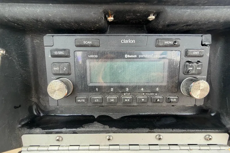 Slide: The Image of Clarion M608 stereo system in a 2007 Sea Ray SLX 250 boat dashboard. - 62
