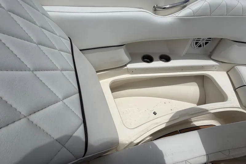 Slide: The Image of Interior of 2007 Sea Ray SLX 250 boat with quilted white upholstery. - 48