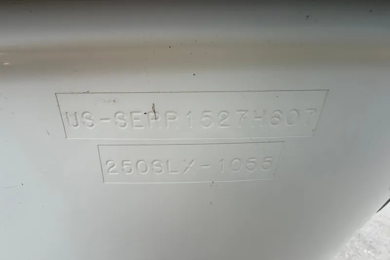 Slide: The Image of 2007 Sea Ray SLX 250 hull identification number embossed on white surface. - 81