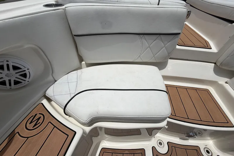 Slide: The Image of White leather seating on 2007 Sea Ray SLX 250 boat with teak flooring. - 71